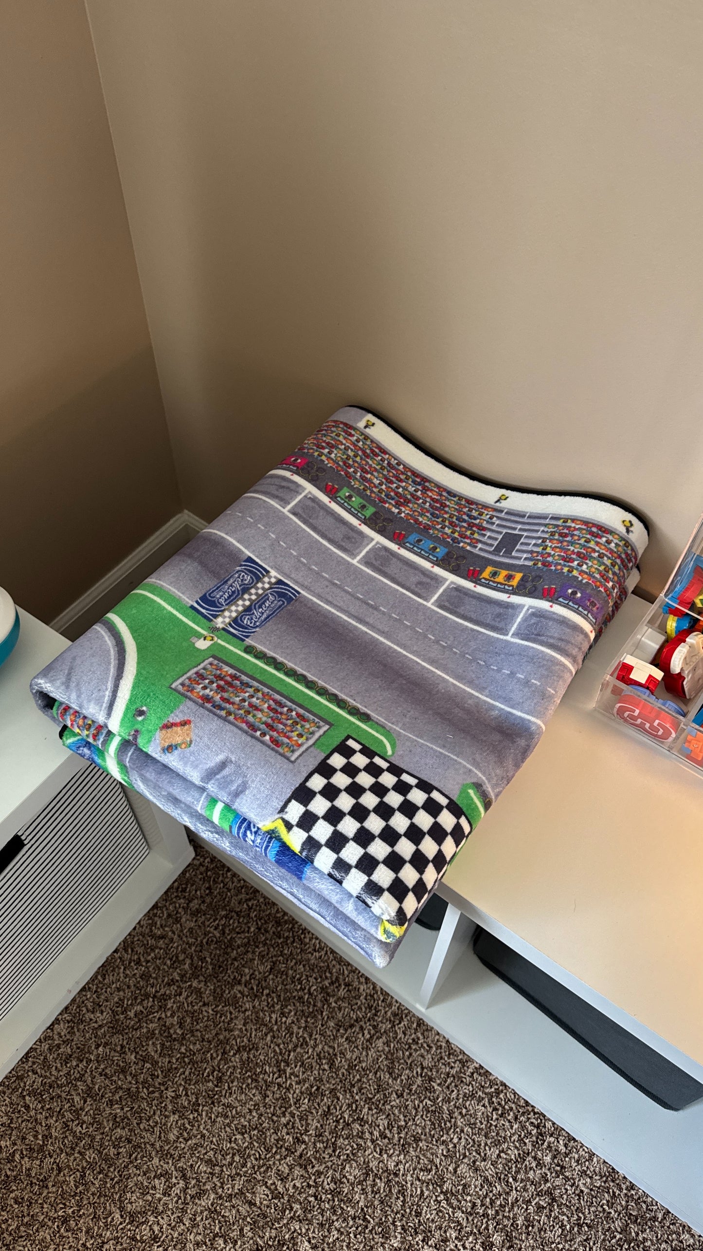 Track folded and stowed on shelf