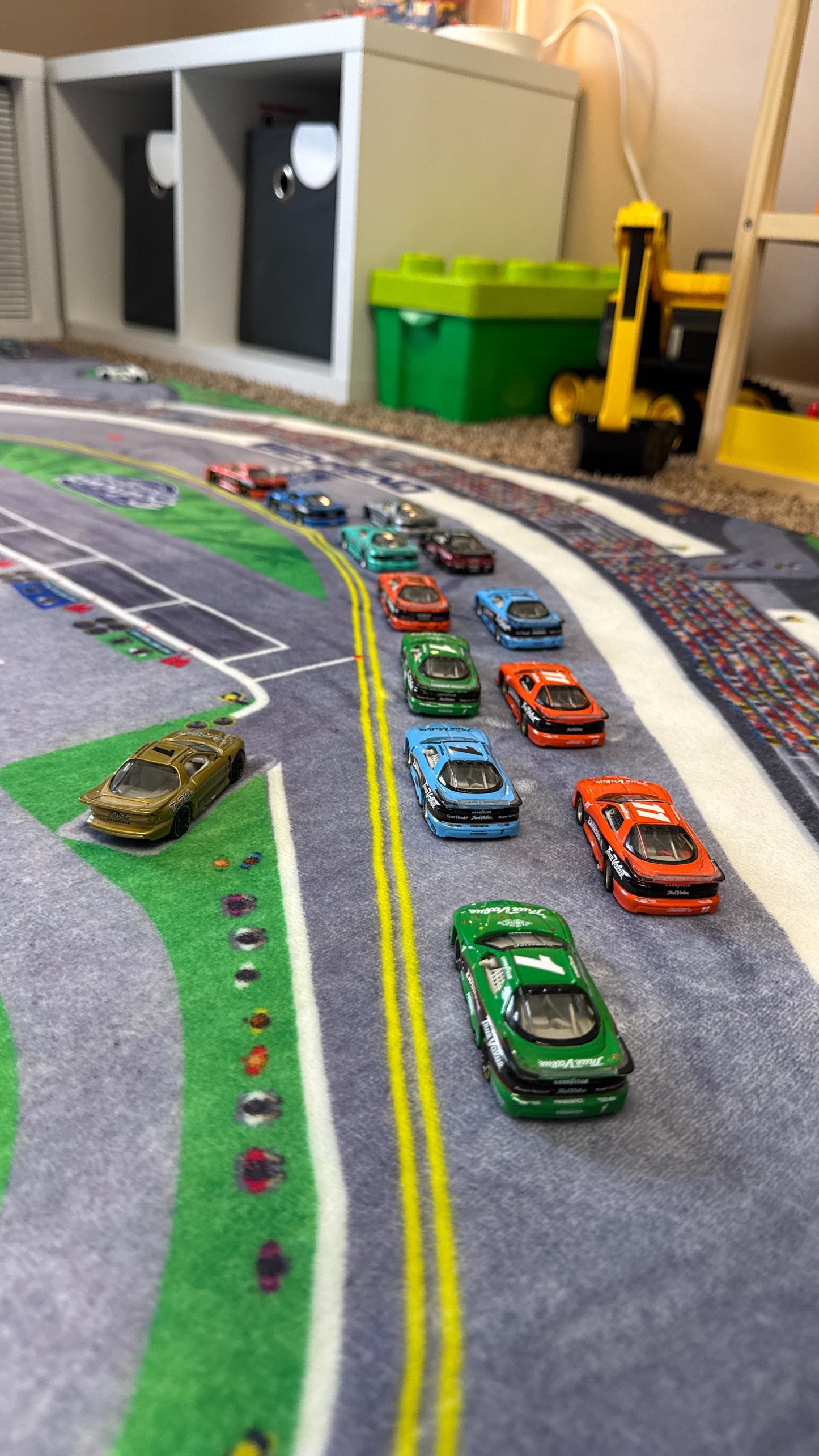 Closeup of cars on the racetrack rug