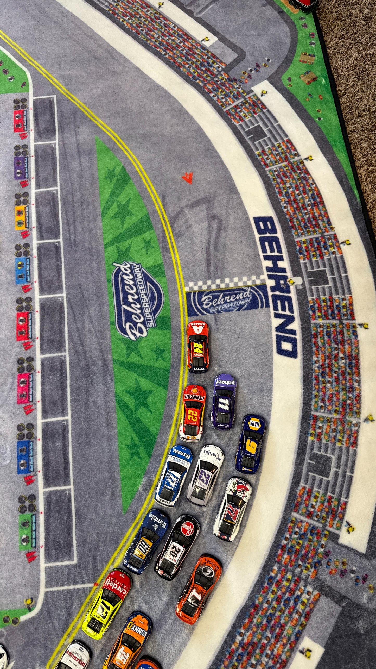 frontstretch view of cars on the track